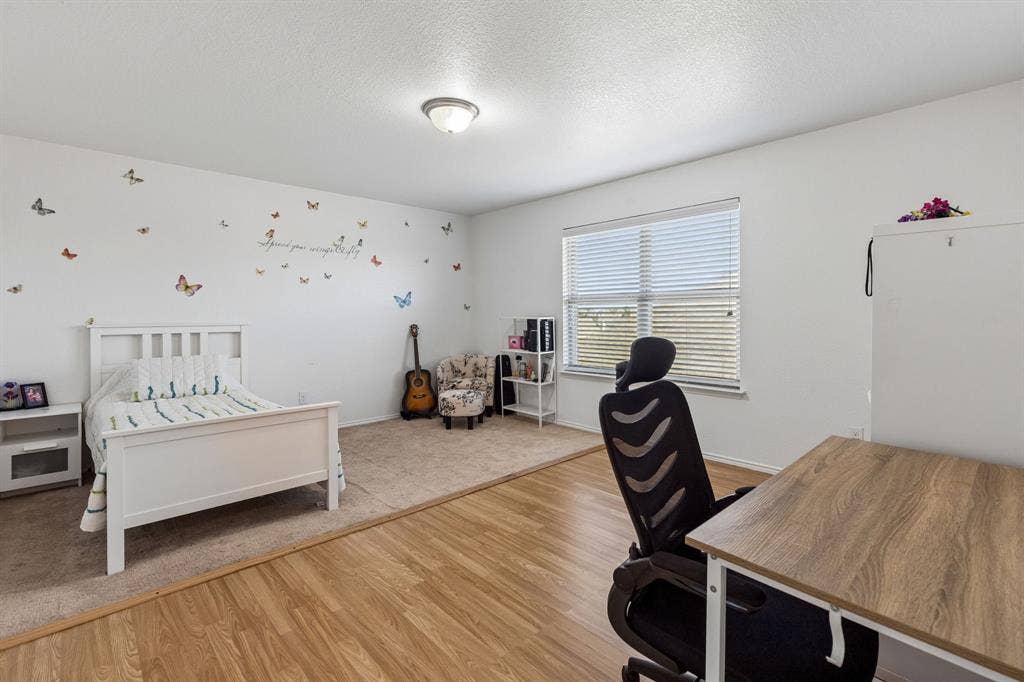 1501 Coyote Ridge Road, Wylie, TX 75098 Wood-finish flooring, recessed lighting, and a window with blinds