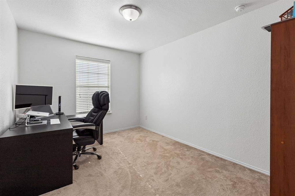 1501 Coyote Ridge Road, Wylie, TX 75098 Neutral wall color, carpeted flooring, window with blinds, and ceiling-mounted light fixture