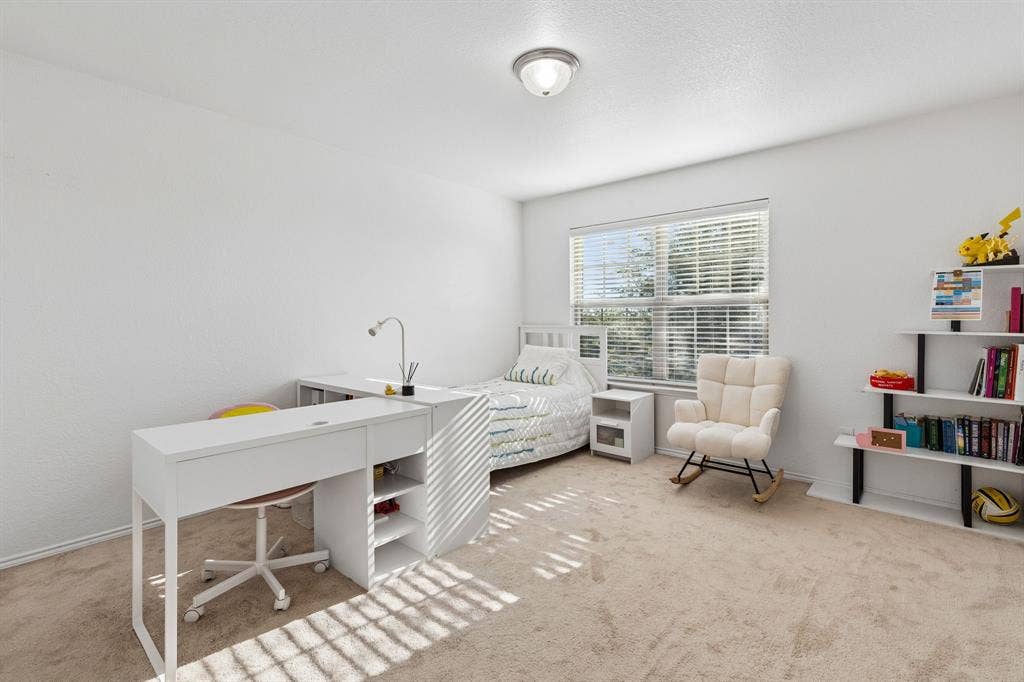 1501 Coyote Ridge Road, Wylie, TX 75098 Carpeted room with a ceiling-mounted light fixture and a window with blinds