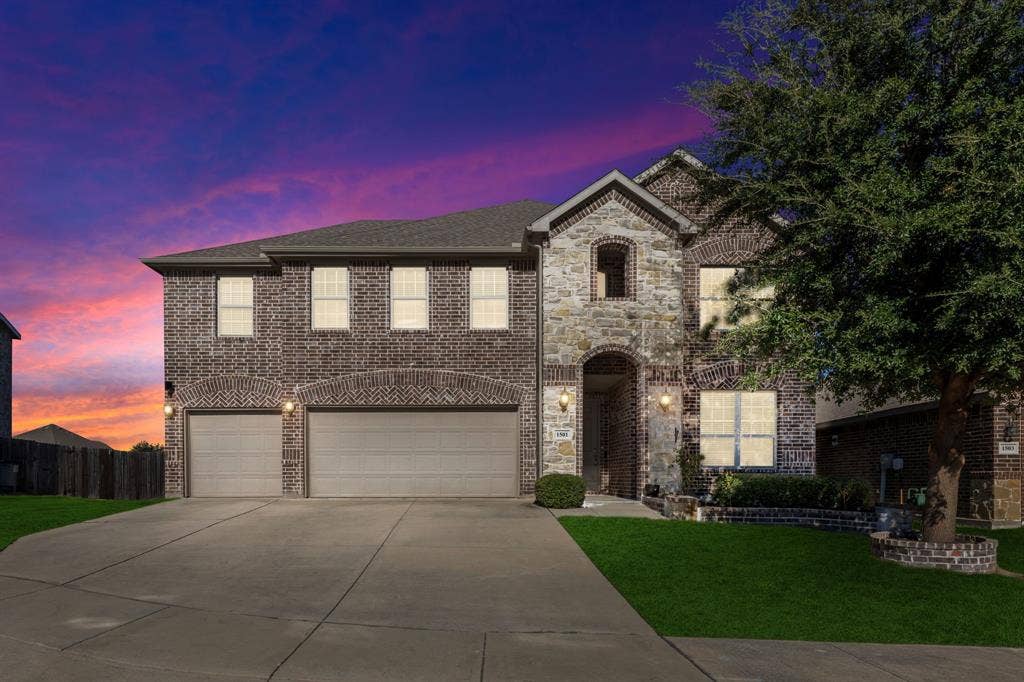 1501 Coyote Ridge Road, Wylie, TX 75098 Brick and stone veneer exterior with a gabled roof