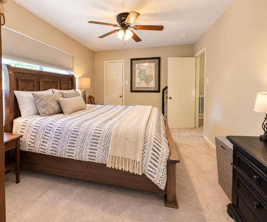 10734 Candlewood Drive, Houston, TX 77042 Carpeted flooring, vaulted ceiling, window with blinds, and a ceiling fan with integrated lighting