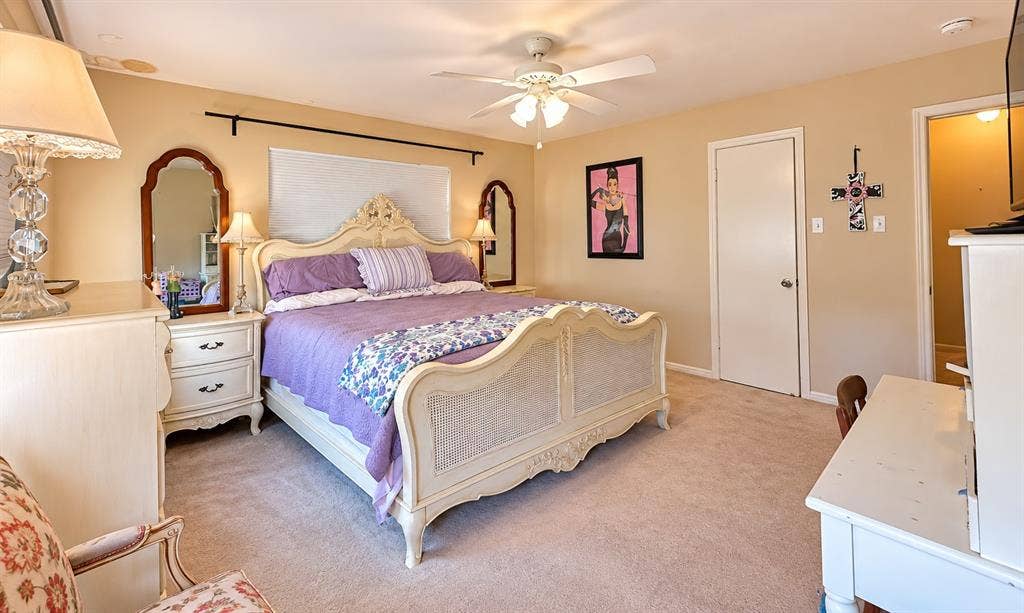 10734 Candlewood Drive, Houston, TX 77042 Wall-to-wall carpeting and a ceiling fan with integrated lighting