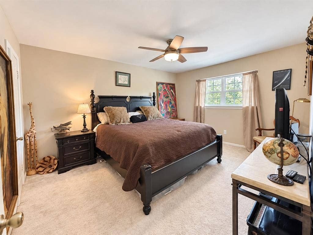10734 Candlewood Drive, Houston, TX 77042 Recessed window with white trim, ceiling fan with integrated lighting, and neutral wall paint
