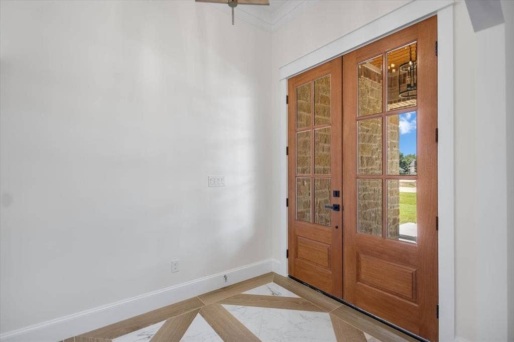 13920 Cedar Hill, Tyler, TX 75704 Double wood entry doors with frosted glass panels, white trim, and patterned tile flooring