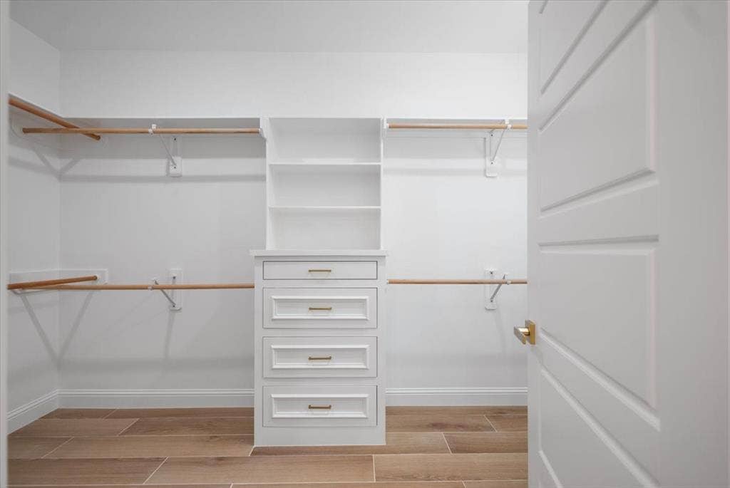 13920 Cedar Hill, Tyler, TX 75704 Custom built-in storage with drawers, open shelving, and hanging rods