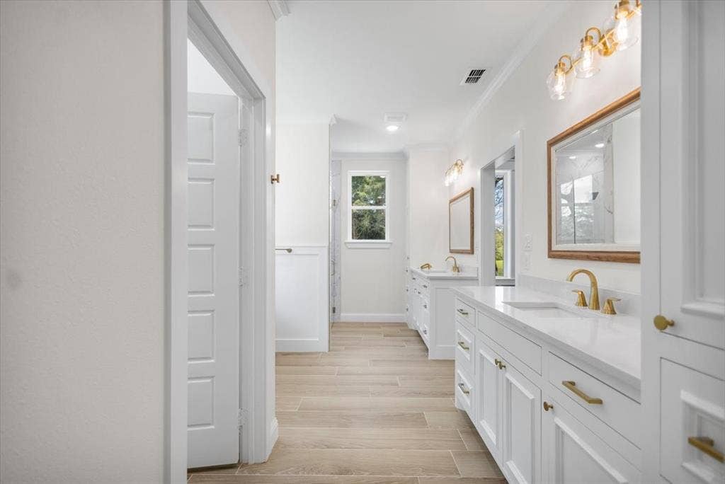 13920 Cedar Hill, Tyler, TX 75704 Dual vanity with white cabinetry and gold-tone hardware