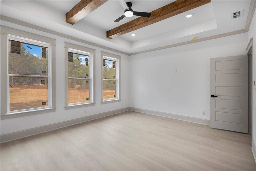 17155 Island Lake Dr., Tyler, TX 75708 Tray ceiling with wood-finish beams and recessed lighting