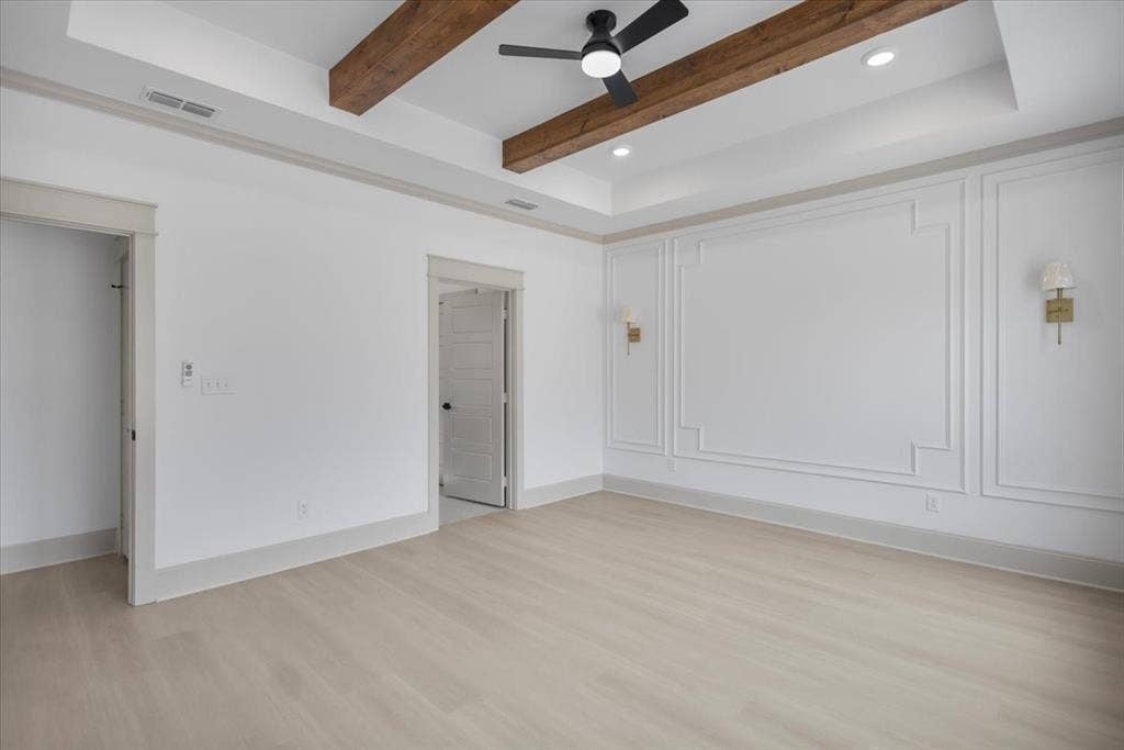 17155 Island Lake Dr., Tyler, TX 75708 Tray ceiling with wood-finish beams, recessed lighting, and a ceiling fan