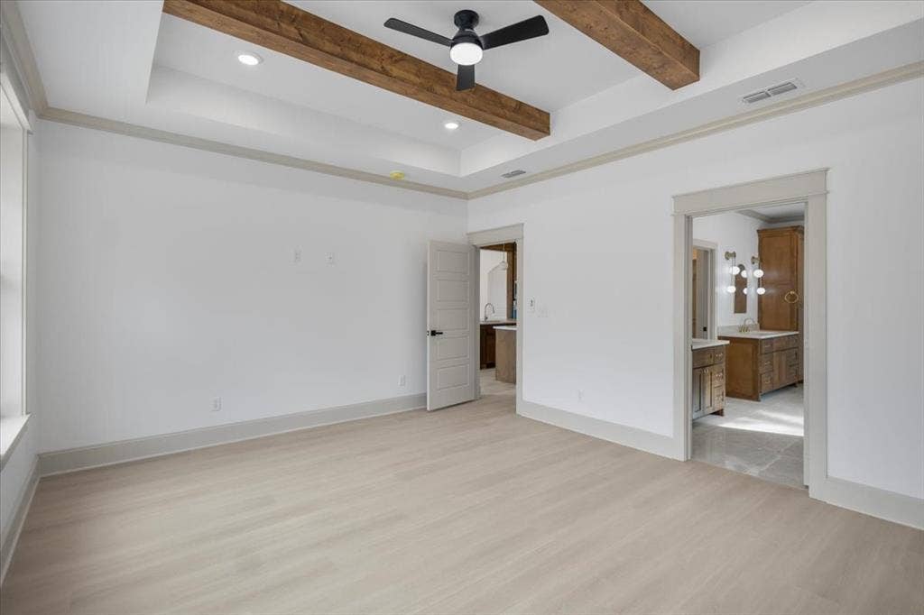 17155 Island Lake Dr., Tyler, TX 75708 Tray ceiling with recessed lighting and wood-finish beams