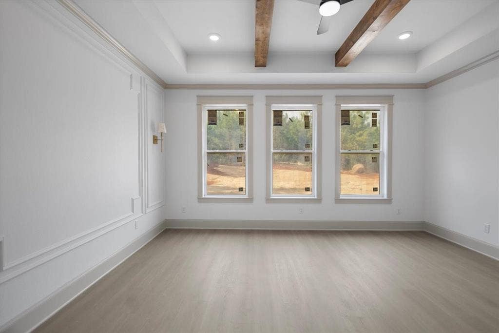 17155 Island Lake Dr., Tyler, TX 75708 Tray ceiling with recessed lighting and exposed wood beams