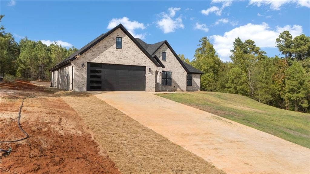 17155 Island Lake Dr., Tyler, TX 75708 Light brick exterior with dark trim windows