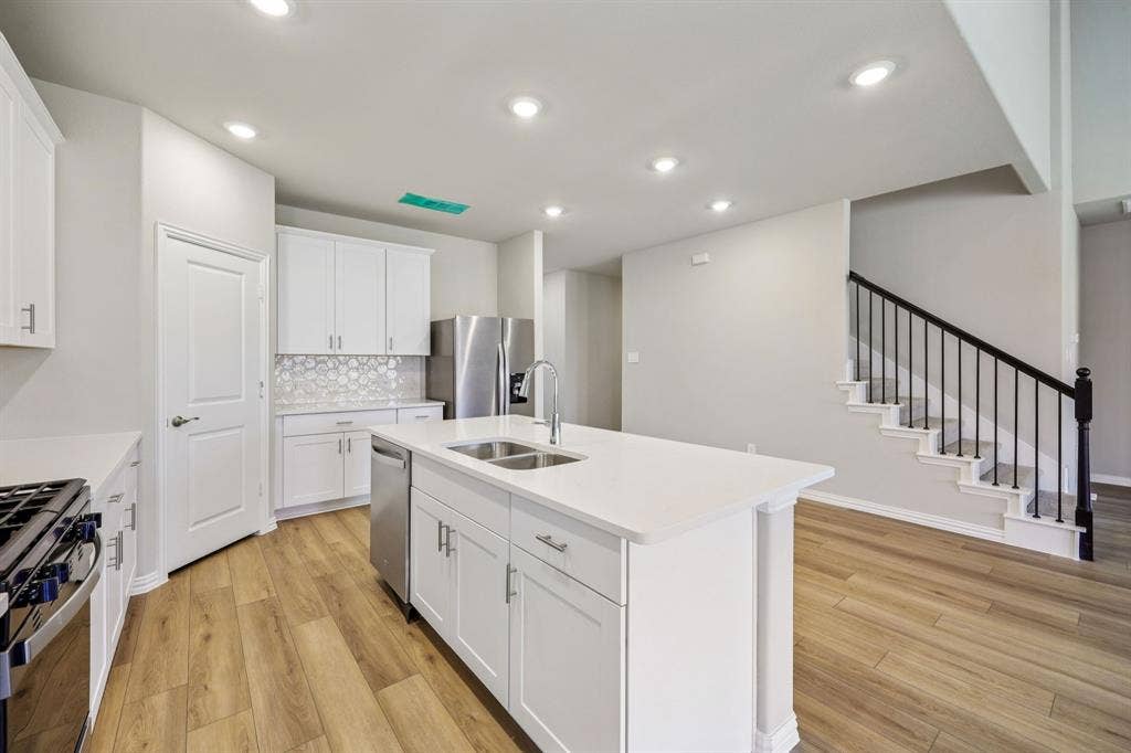 412 Watertown Drive, Princeton, TX 75071 Photo is not of the actual home, but is an inspirational photo of builder’s model home and may depict options, furnishings, and/or decorator features that are not included.