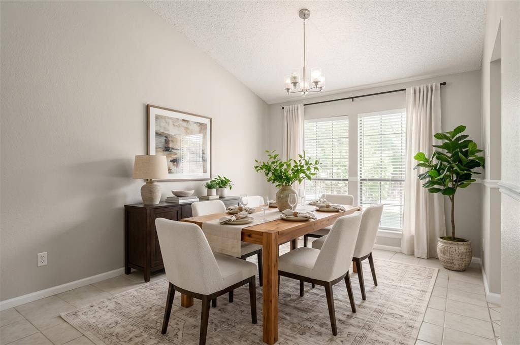 204 Timber Ridge Lane, Coppell, TX 75019 Vaulted ceiling, ceiling-mounted light fixture, dual windows with blinds, built-in shelving, and tile flooring