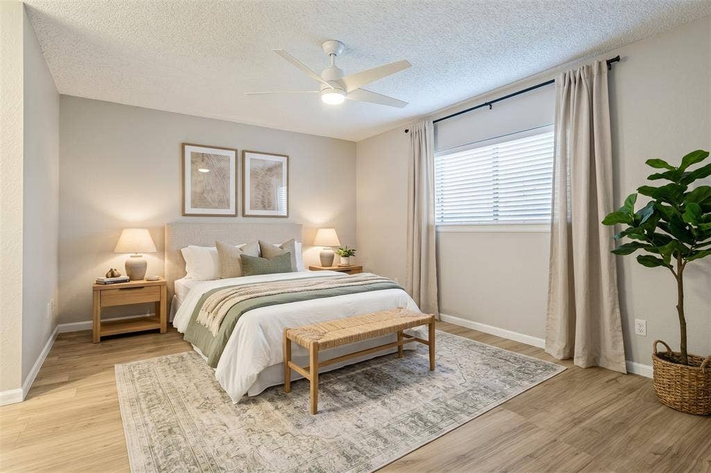 204 Timber Ridge Lane, Coppell, TX 75019 Recessed window with blinds, wood-finish flooring, and a ceiling fan with integrated lighting
