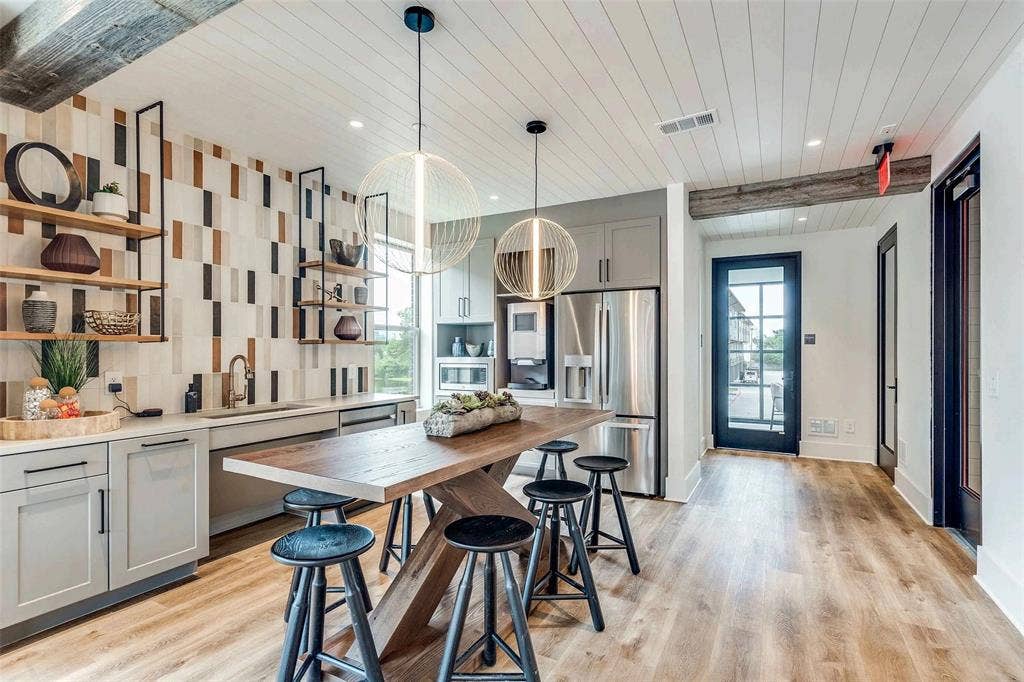 4020 McEwen Road, #9121, Farmers Branch, TX 75244 Kitchen with gray cabinetry, wooden ceiling, appliances with stainless steel finishes, open shelves, and light wood finished floors