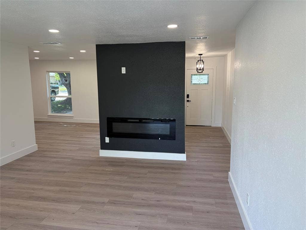1006 Heritage Drive, Garland, TX 75043 Electric Fireplace with TV Wall