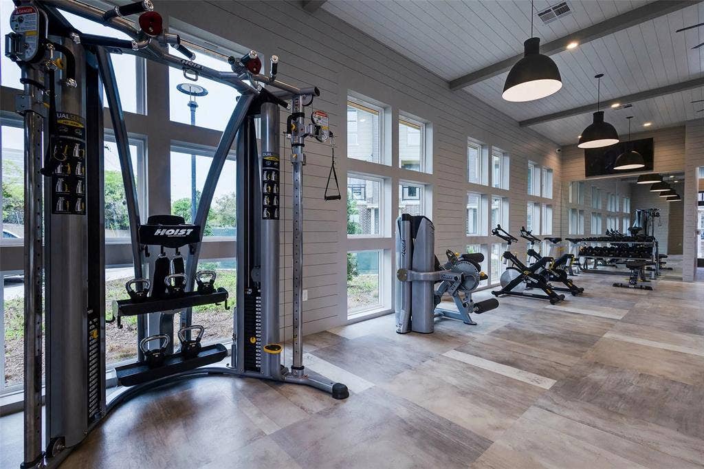 4020 McEwen Road, #8115, Farmers Branch, TX 75244 Gym with wood walls, recessed lighting, a wooden ceiling with exposed beams, and a high ceiling