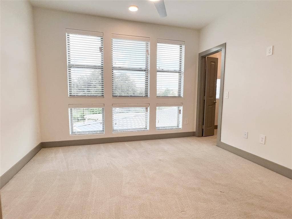 4020 McEwen Road, #8115, Farmers Branch, TX 75244 Unfurnished room with plenty of natural light, light carpet, ceiling fan, and recessed lighting