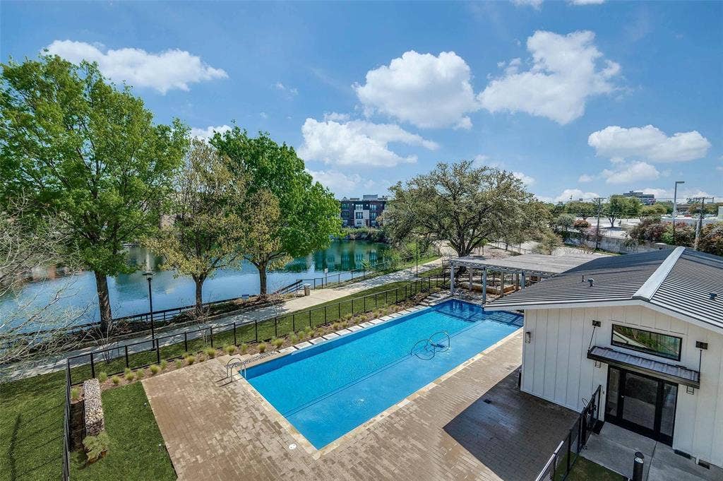 4020 McEwen Road, #8115, Farmers Branch, TX 75244 View of pool featuring a water view and a patio area
