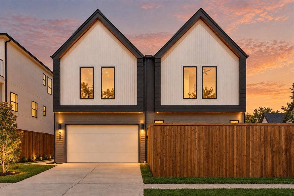 903 Bayonne Street, Dallas, TX 75212 Contemporary architectural style featuring white board and batten siding, dark trim, and a prominent peaked roofline