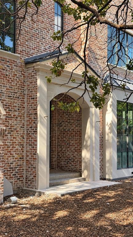 6131 Lupton Drive, Dallas, TX 75225 Natural "Chicago Blend" brick with stucco and cast stone accents. Lincoln Bronze aluminum clad windows.