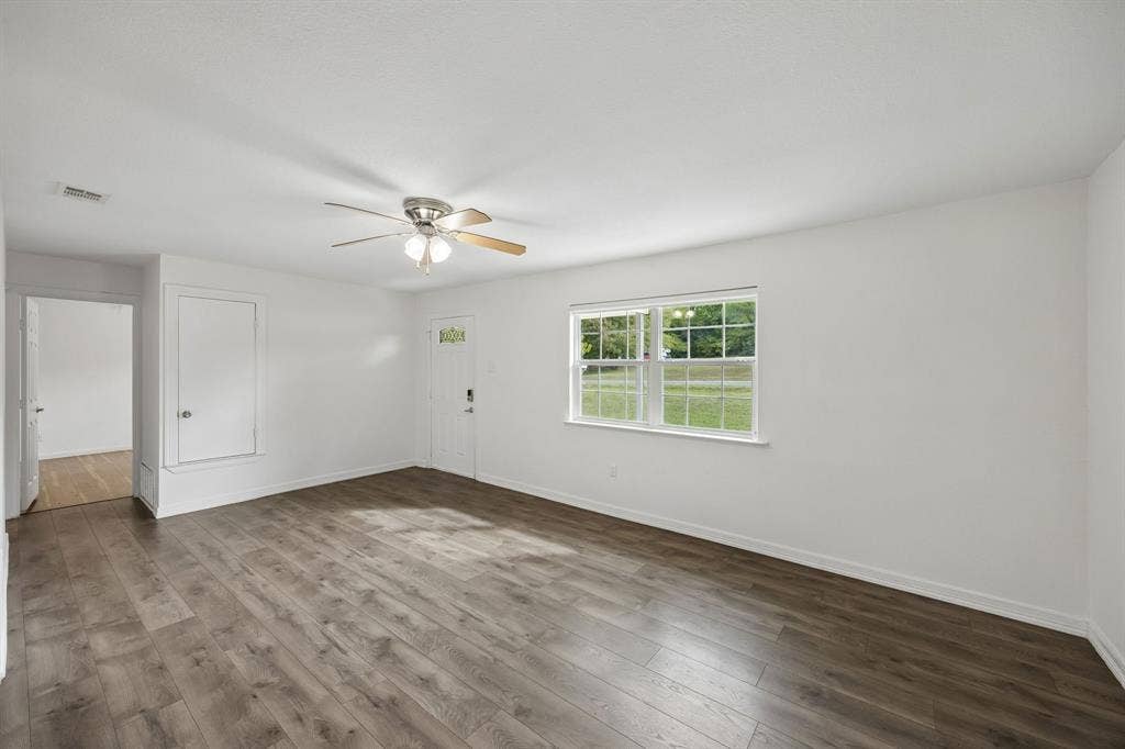 2245 County Road 337, McKinney, TX 75071 Interior space featuring wood-finish flooring, a multi-light ceiling fan, and a multi-pane window