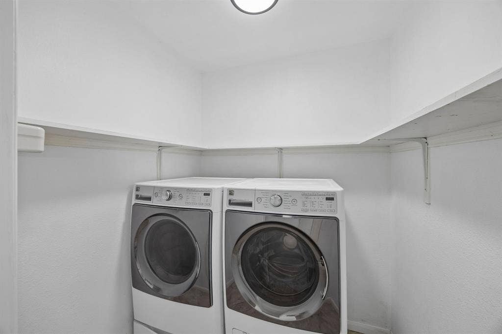 2245 County Road 337, McKinney, TX 75071 Laundry area featuring white built-in shelving and overhead lighting