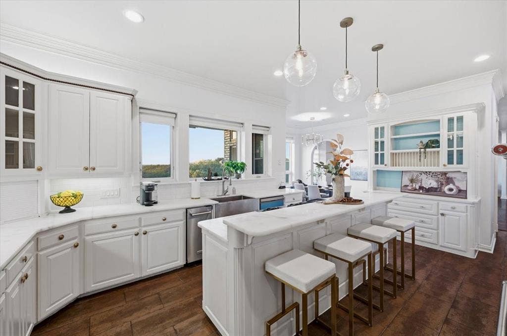 2945 Emerald Sound Drive, Cedar Hill, TX 75104 Kitchen featuring white cabinetry, stone countertops, a stainless steel undermount sink, wood-finish flooring, and glass pendant lighting