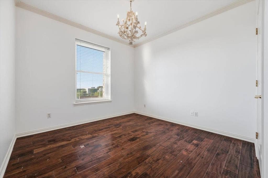 2945 Emerald Sound Drive, Cedar Hill, TX 75104 Room featuring wood-finish flooring, crown molding, and an ornate chandelier
