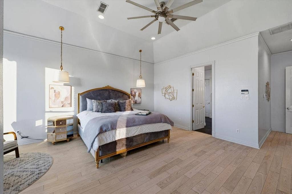 2945 Emerald Sound Drive, Cedar Hill, TX 75104 Vaulted ceilings, wood-finish flooring, recessed lighting, ceiling fan, and pendant light fixtures