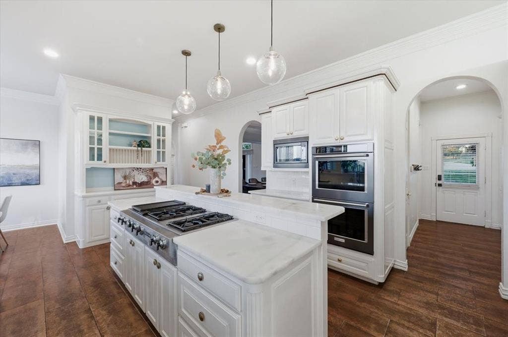 2945 Emerald Sound Drive, Cedar Hill, TX 75104 Kitchen featuring white cabinetry, stone countertops, built-in double wall ovens, a gas cooktop, and glass globe pendant lighting