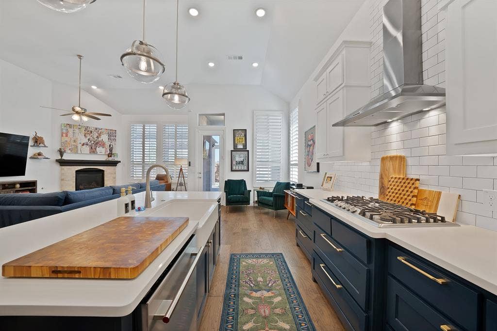 15032 Chipwood Drive, Aledo, TX 76008 Gas Range, double oven, garbage disposal, microwave, exhaust fan,white farm sink