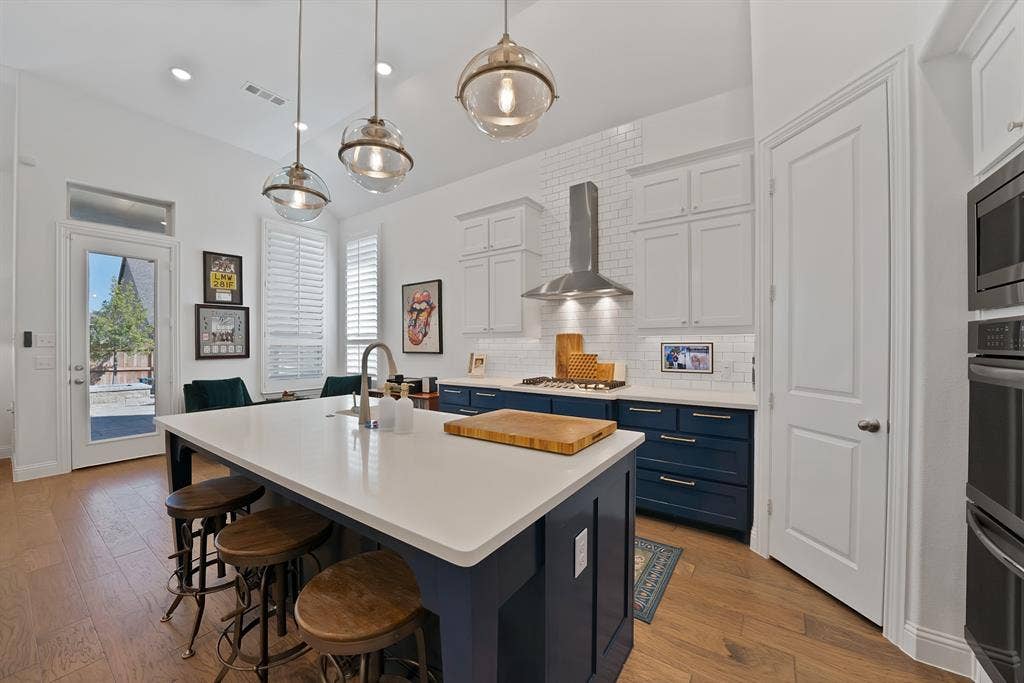 15032 Chipwood Drive, Aledo, TX 76008 Gas Range, double oven, garbage disposal, walk in plantry, microwave, exhaust fan, white farm sink