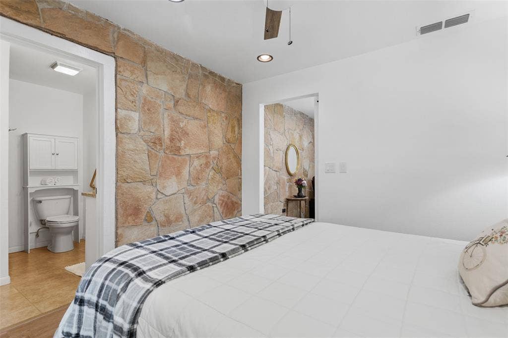 Accent stone wall with recessed lighting