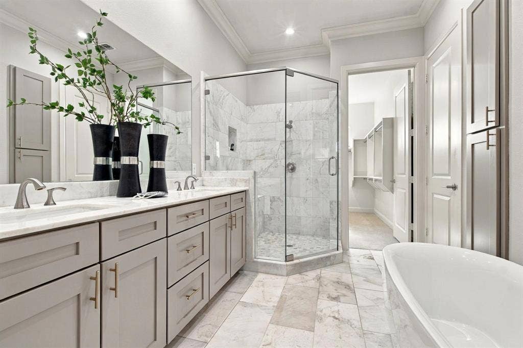 Primary bath, dual sinks, slipper tub and stand alone shower on third level