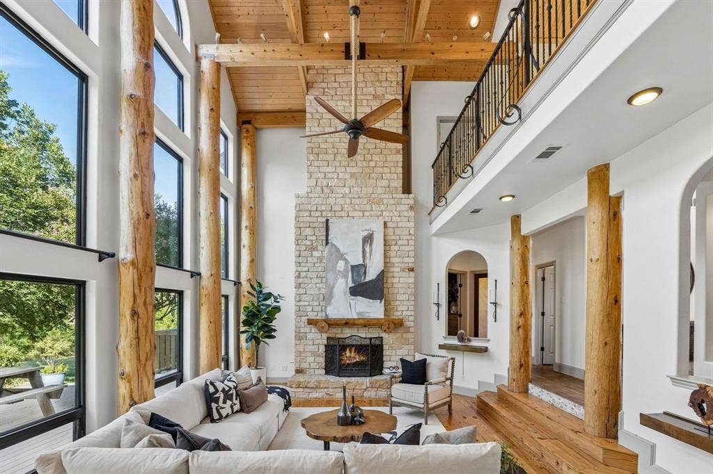 7750 Cottonwood Street, Frisco, TX 75033 Stunning living area with vaulted ceilings, natural wood accents and stone fireplace.
