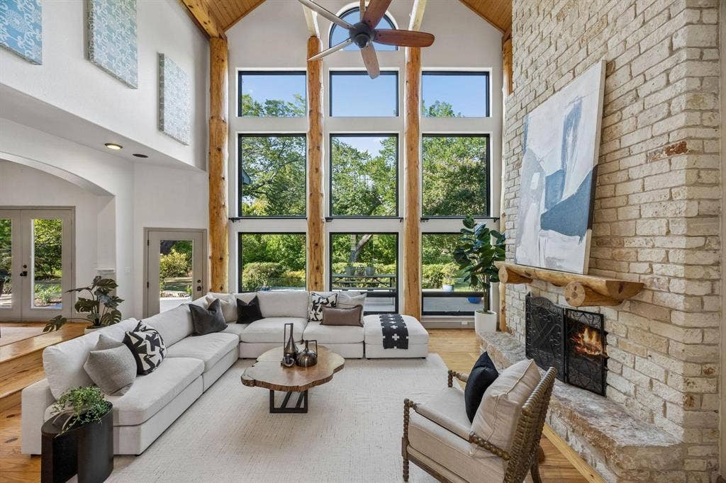 7750 Cottonwood Street, Frisco, TX 75033 Towering black-framed windows showcase incredible views of the property.