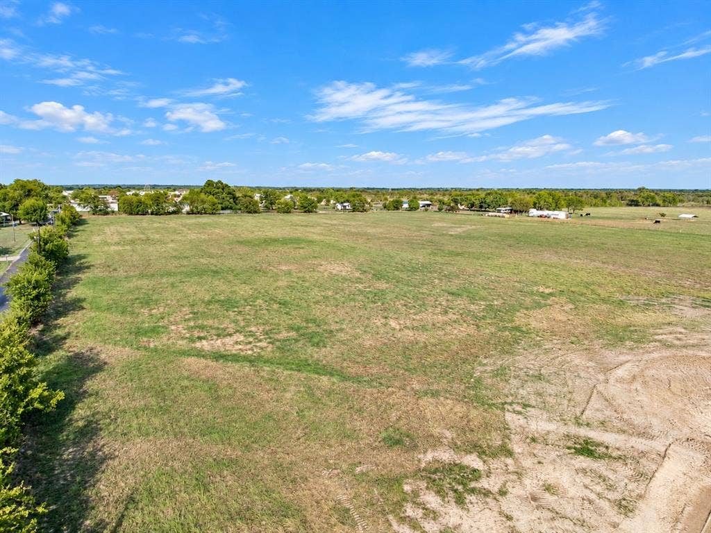 7697 County Road 4094, Scurry, TX 75158 Expansive parcel of open land featuring mature trees and level topography
