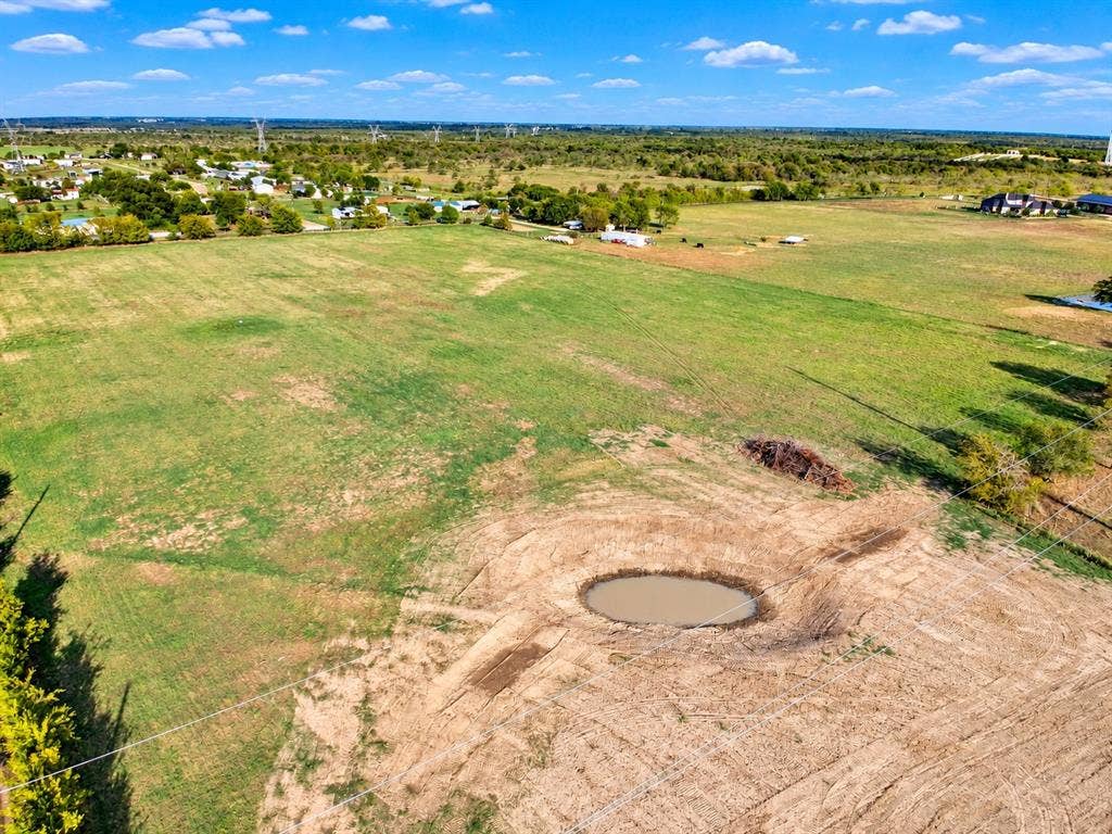 7697 County Road 4094, Scurry, TX 75158 Expansive parcel of land featuring open pasture and a natural pond