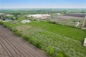 Lot 3 Bozek Lane, Ennis, TX 75119 Expansive acreage featuring cultivated land, a natural pond, and surrounding green spaces