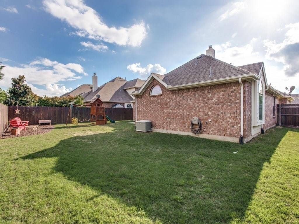12316 Sailmaker Lane, Frisco, TX 75035 Brick exterior with an arched window and a bay window