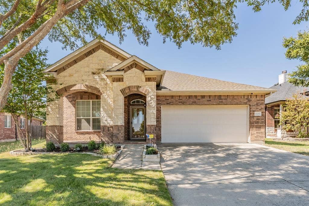2205 Clairborne Drive, Fort Worth, TX 76177 Brick and stone facade with arched entryways