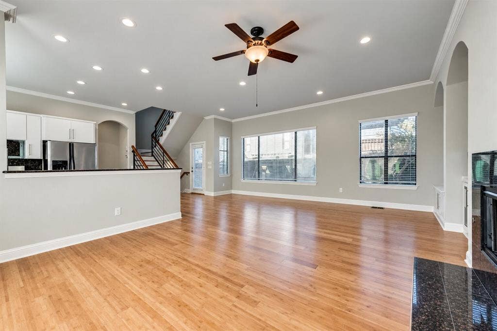 4432 Bowser Avenue, #C, Dallas, TX 75219 Expansive living area with wood-finish flooring, recessed lighting, and a ceiling fan