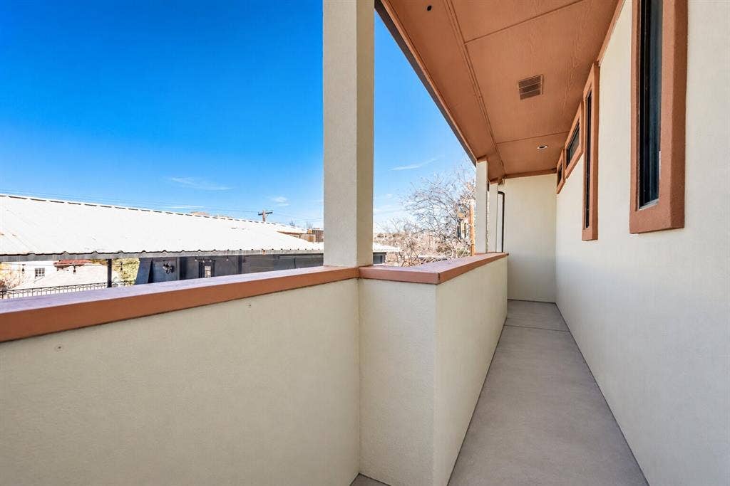 4432 Bowser Avenue, #C, Dallas, TX 75219 Covered balcony with a solid railing, concrete flooring, and recessed ceiling lighting