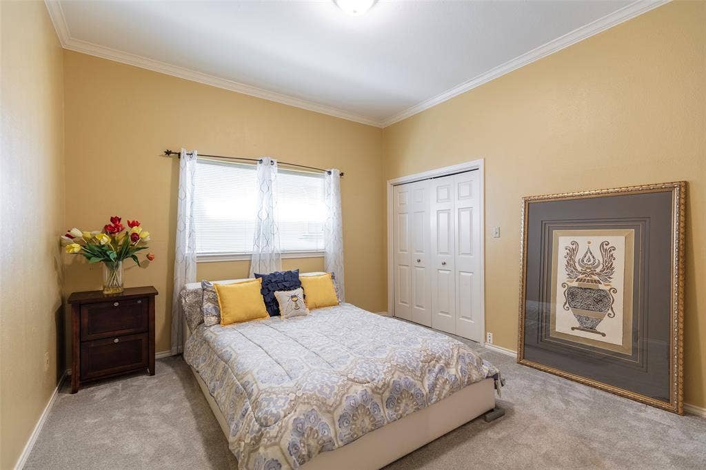 A second bedroom downstairs offers a comfortable place for overnight guests or extended stays, with a full bath nearby.
