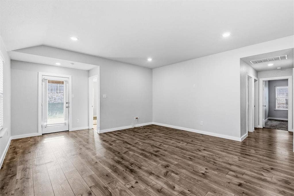 2333 Bellewood Court, Crandall, TX 75114 Wood-finish flooring, recessed lighting, white trim, and a glass-paneled door