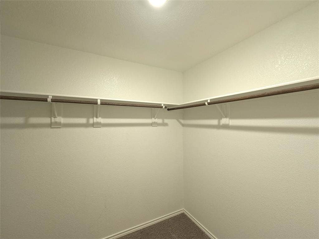 1148 Samantha Drive, Dallas, TX 75253 Corner closet with built-in shelving and hanging rods