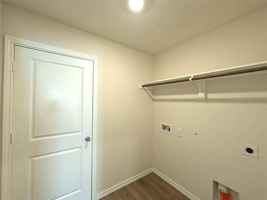 1148 Samantha Drive, Dallas, TX 75253 Utility area with wood-finish flooring, overhead shelving, and integrated lighting