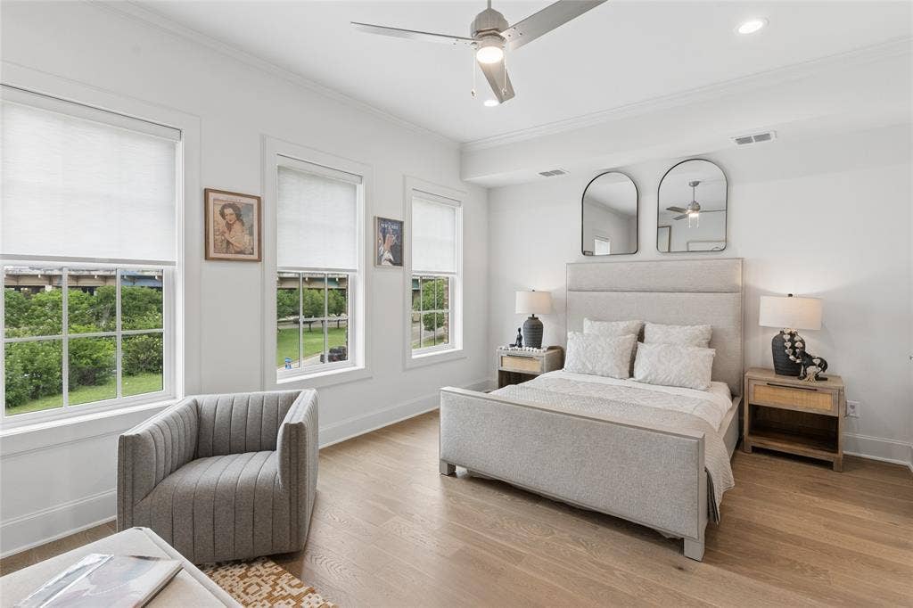 2401 Canton Street, #1002, Dallas, TX 75201 The spacious primary suite offers a private retreat, complete with a spa-inspired en suite bathroom and an expansive walk-in closet. Image of model home with similar layout.