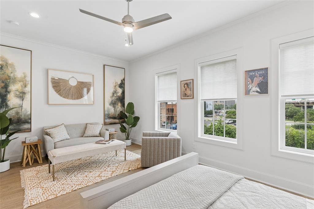 2401 Canton Street, #1002, Dallas, TX 75201 Huge primary bedroom with room for sitting area. Image of model home with similar layout.